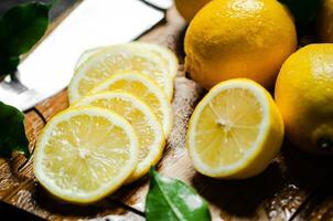 Fresh lemons. On cutting board. photo