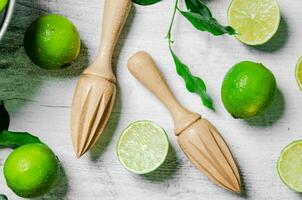 Fresh limes. On white table. photo