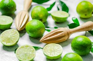 Fresh limes. On white table. photo