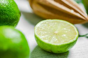 Fresh limes. On white table. photo