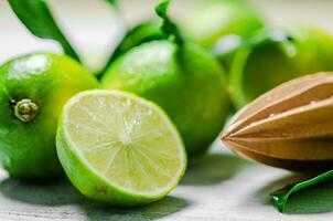 Fresh limes. On white table. photo