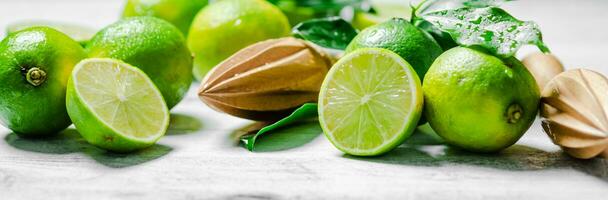 Fresh limes. On white table. photo