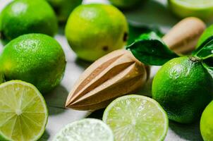 Fresh limes. On white table. photo