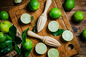 Fresh limes. On wooden table. photo