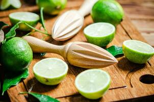 Fresh limes. On wooden table. photo