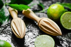 Fresh limes. On black table. photo