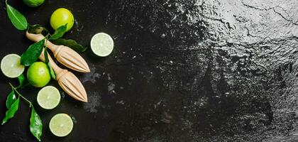 Fresh limes. On black table. photo