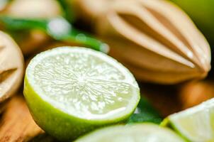 Fresh limes. On wooden table. photo