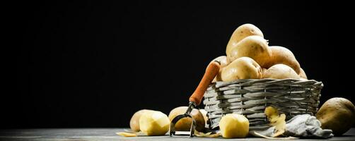 Fresh potatoes. On black background. photo