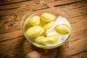 Fresh peeled potatoes. photo