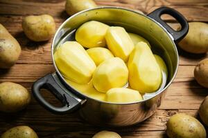 Fresh peeled potatoes. photo