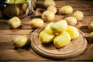 Fresh peeled potatoes. photo