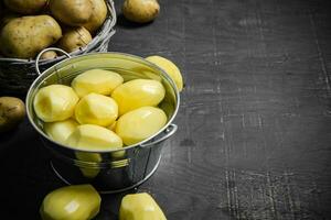 Fresh peeled potatoes. photo