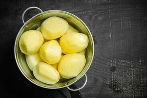 Fresh peeled potatoes. photo