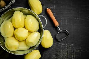 Fresh peeled potatoes. photo