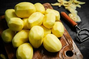 Fresh peeled potatoes. photo