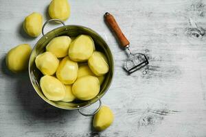 Fresh peeled potatoes. photo