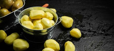 Fresh peeled potatoes. photo