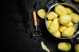 Fresh peeled potatoes. photo