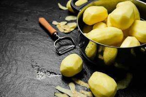 Fresh peeled potatoes. photo