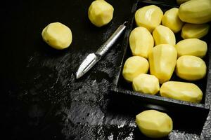 Fresh peeled potatoes. photo