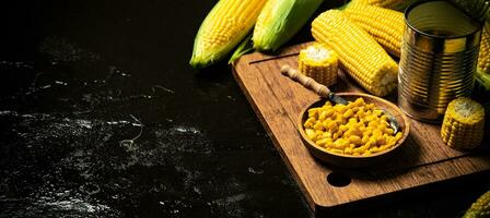 Canned corn on board. photo