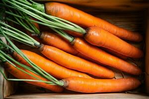 Fresh carrots in old box. photo