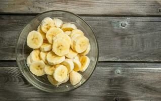 Banana slices in a glass bowl. photo