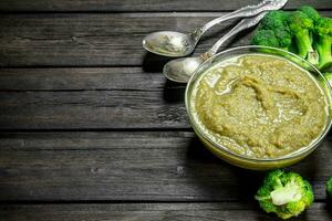 Broccoli puree with a spoon. photo