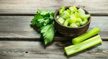 Pieces of celery in a bowl. photo