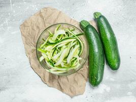 Pieces of zucchini in a glass bowl. photo