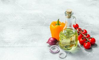 Organic food. Ripe vegetables with olive oil. photo