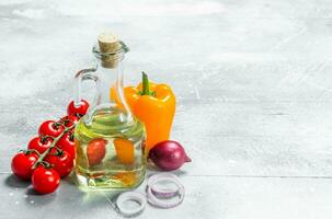 Organic food. Ripe vegetables with olive oil. photo