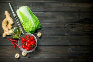 Organic food. Ripe tomatoes with green vegetables. photo