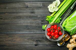 Organic food. Ripe tomatoes with green vegetables. photo