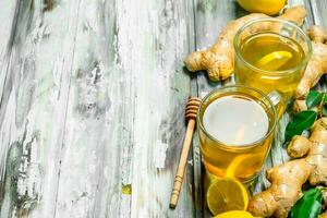 Tea with lemon and fresh ginger. photo