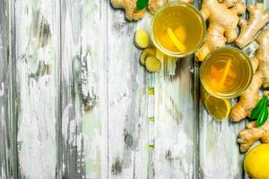 Tea with lemon and fresh ginger. photo