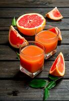 Grapefruit juice in a glass. photo