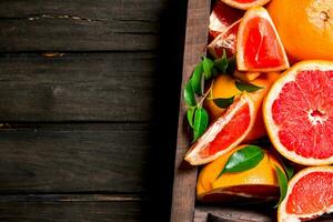 Ripe grapefruits in the box. photo