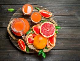 Grapefruit juice in a glass on tray. photo