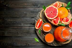 Grapefruit juice in a glass on tray. photo