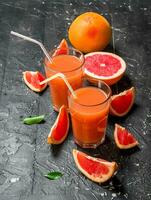 Grapefruit juice in a glass. photo