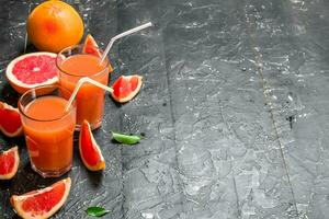 Grapefruit juice in a glass. photo