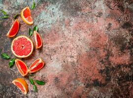 Fresh grapefruit with leaves. photo