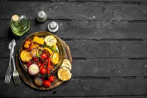 Grilled vegetables in a pan with spices. photo