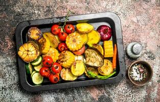 Grilled vegetables on a baking sheet. photo