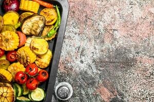 Grilled vegetables on a baking sheet. photo