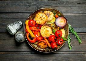 A variety of grilled vegetables with a frying pan. photo