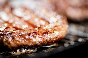 Juicy grilled burger. Macro background. photo