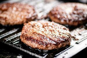 Grilled burger in a frying pan. photo